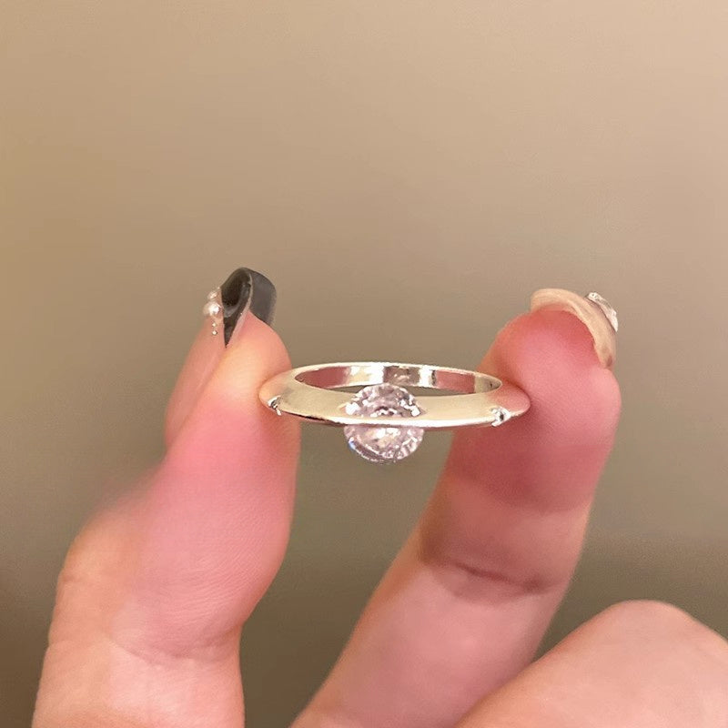 Rotating Zirconia Planet Surrounds Zirconia Ring, Exuding a Fashionable And High-End Vibe for Women. Finger Ring Is Fashionable, Simple, And Niche in Design