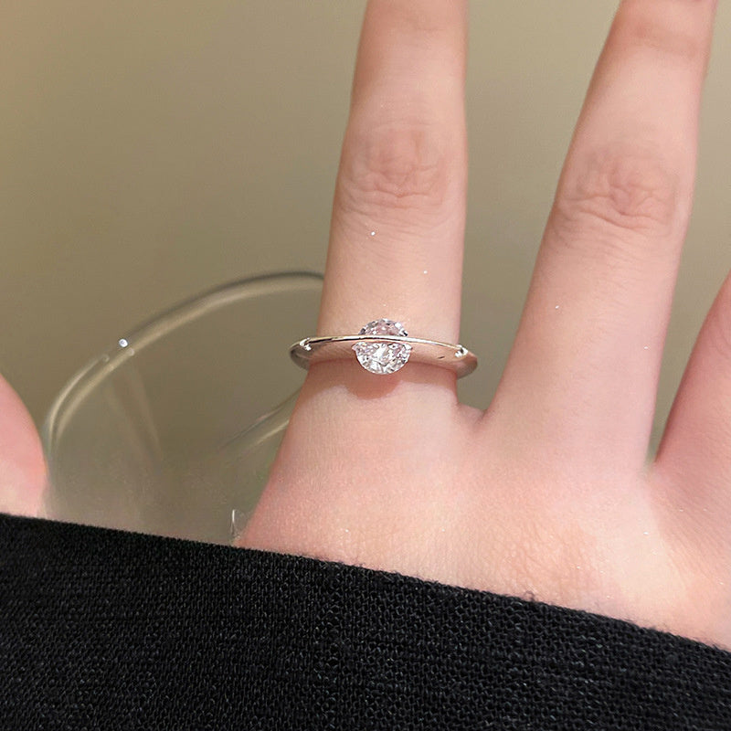 Rotating Zirconia Planet Surrounds Zirconia Ring, Exuding a Fashionable And High-End Vibe for Women. Finger Ring Is Fashionable, Simple, And Niche in Design
