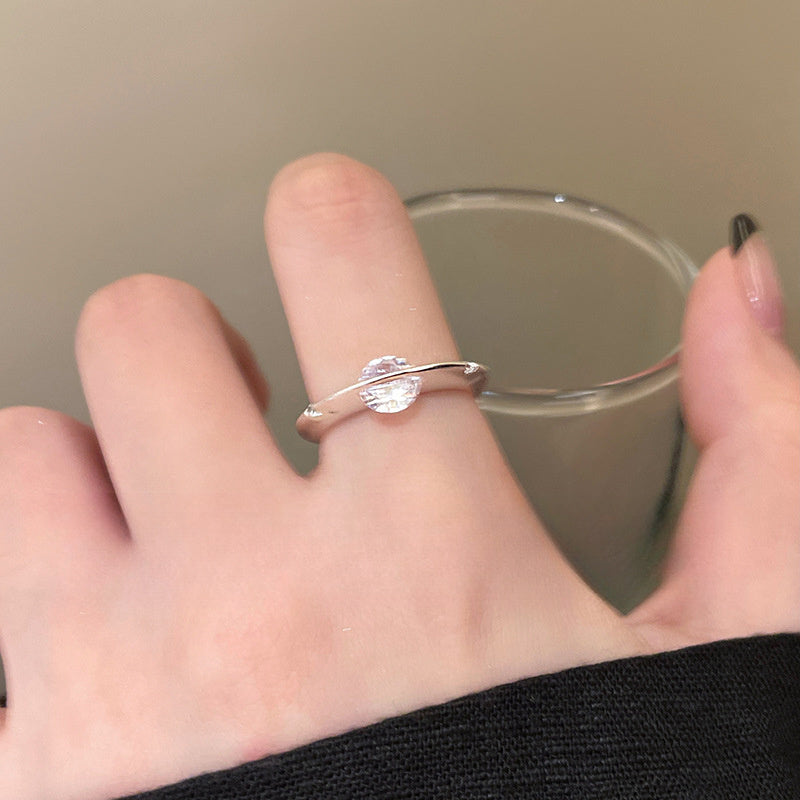 Rotating Zirconia Planet Surrounds Zirconia Ring, Exuding a Fashionable And High-End Vibe for Women. Finger Ring Is Fashionable, Simple, And Niche in Design